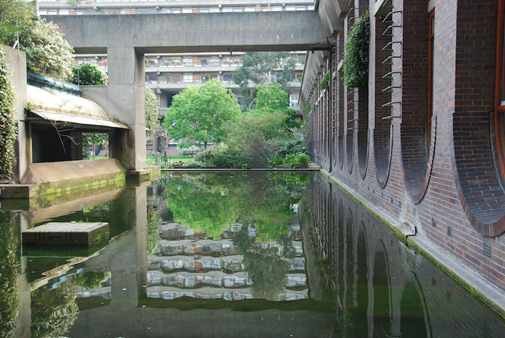 barbican lake with reflection on to water of buildings