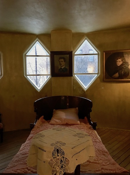 bedroom of Melnikov House in Moscow family bedroom with golden walls