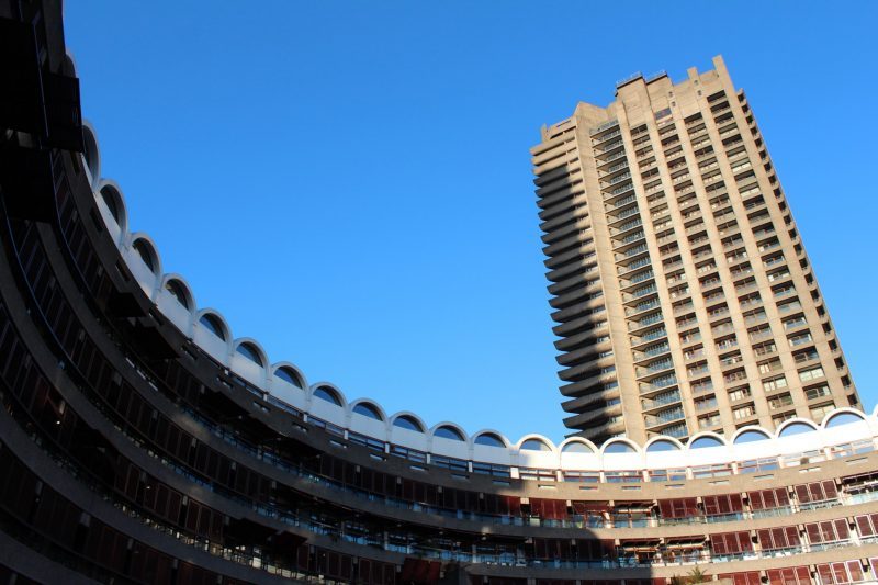 Frobisher Crescent and Shakespeare Tower Barbican on a sunny day with a blue sky