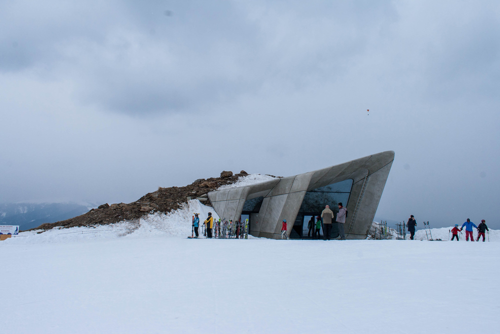 View over museum with skiers and heavy snow underfoot