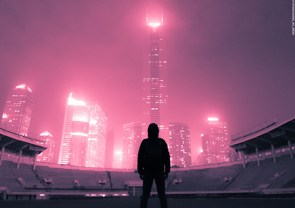 Cityscape bathed in pink light urbexer