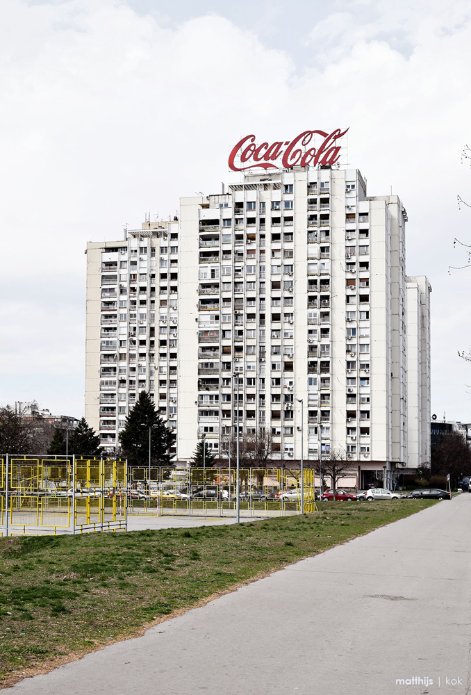 coca cola sign on top of social housing belgrade