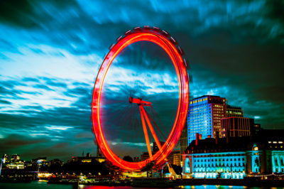 long exposure shot of london eye lit in red