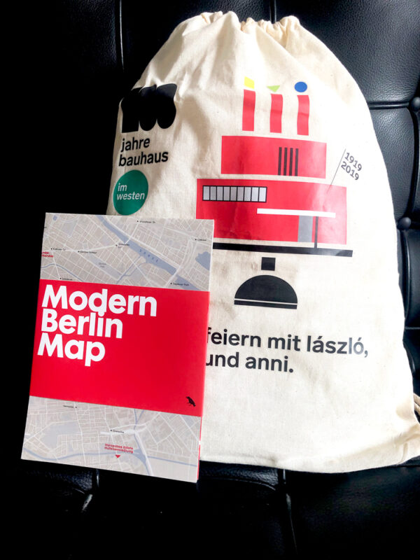 map by blue crow and small tote celebrating bauhaus centenary with images and words printed on the front in red and black on natural cotton background