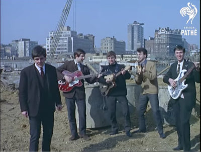 60s pop band Unit 4+2 singing on the building site