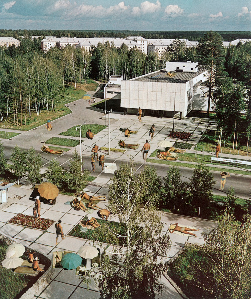 office complex with workers sunbathing humorous image 