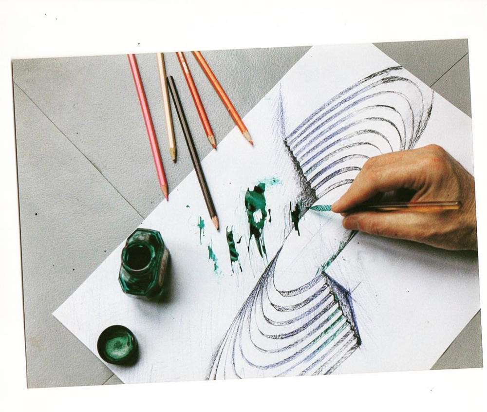 gerard grandval at his desk with pen and green ink 