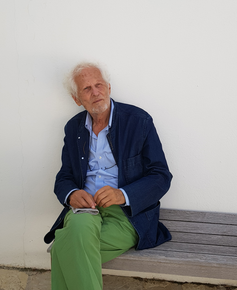Gerard Grandval with green trousers on and blue jacket