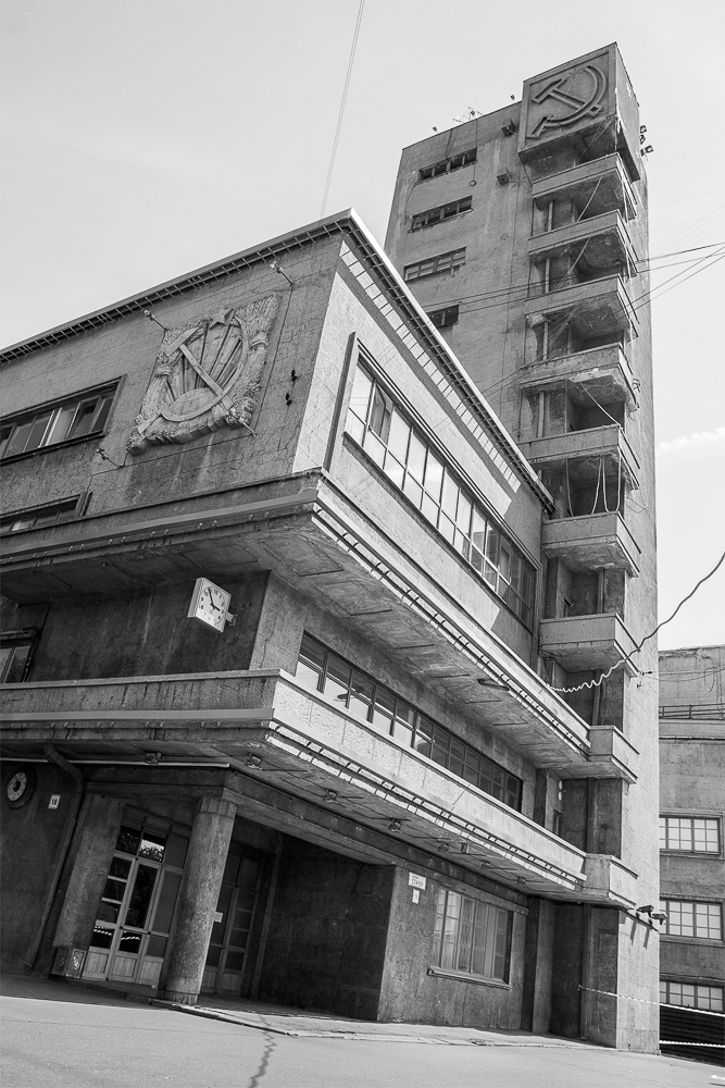 The Kirov District `council Building with huge Hammer & Sickle