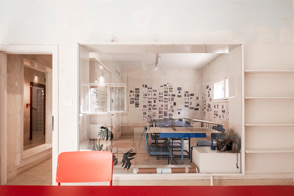 Ground floor interior Liebling Haus with orange chair and photos on wall