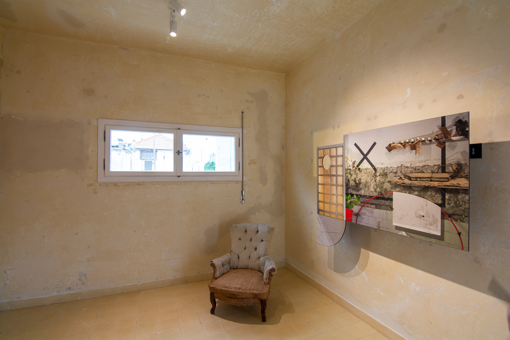 Interior of the Liebling Haus with period chair, unimproved or restored wall surfaces and art display