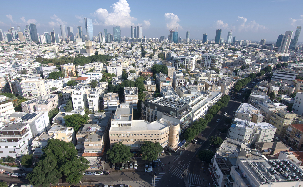 view of city side with high and low rises taken during the day 