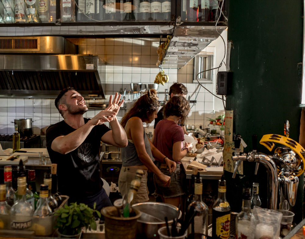 staff behind the bar of Miznon Tel Aviv in action 