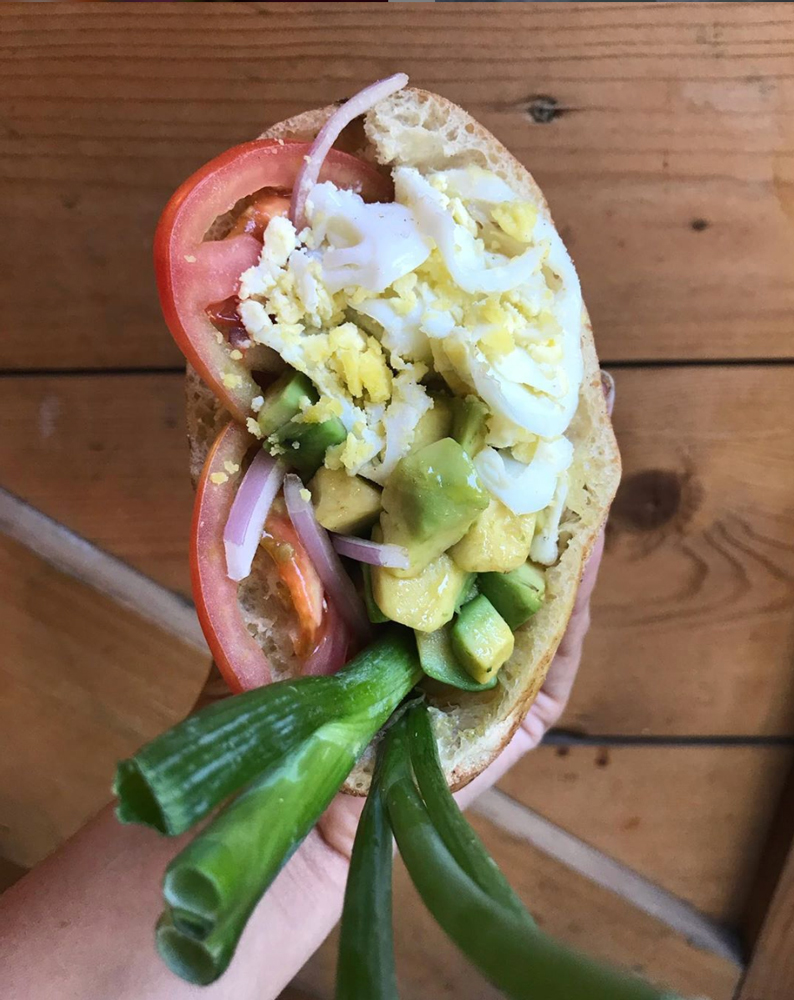 pita bread filled with egg, spring onion and vegetables