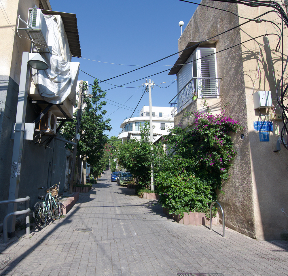 view of side street and original houses with view of international style 