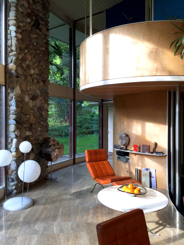 villa kolb looking to the garden with view of copper cylinder in interior 