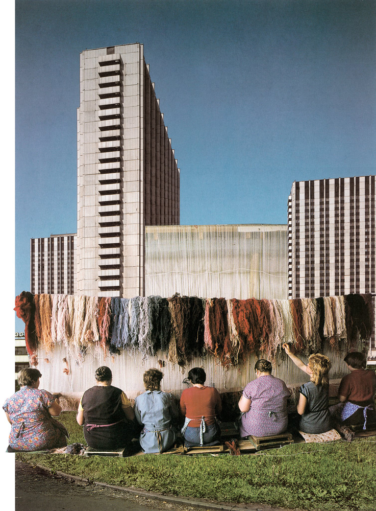 weavers with skeins of yarn sitting in front of a soviet constructivist building