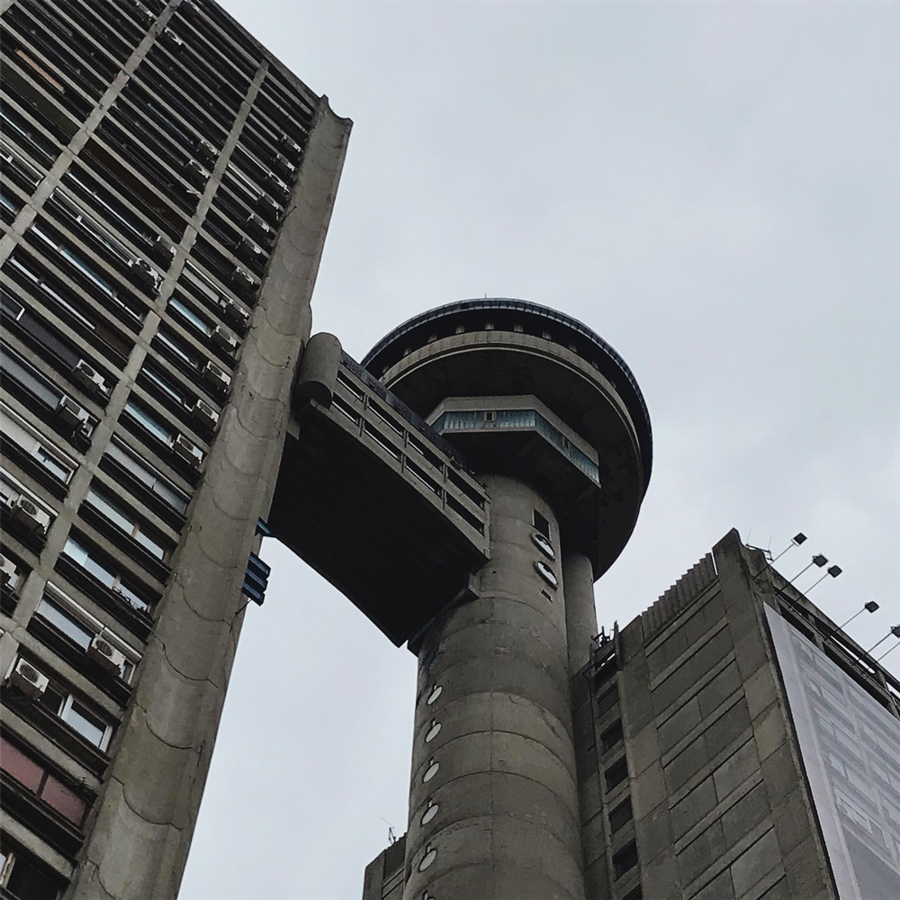 upper section of genex tower with advert