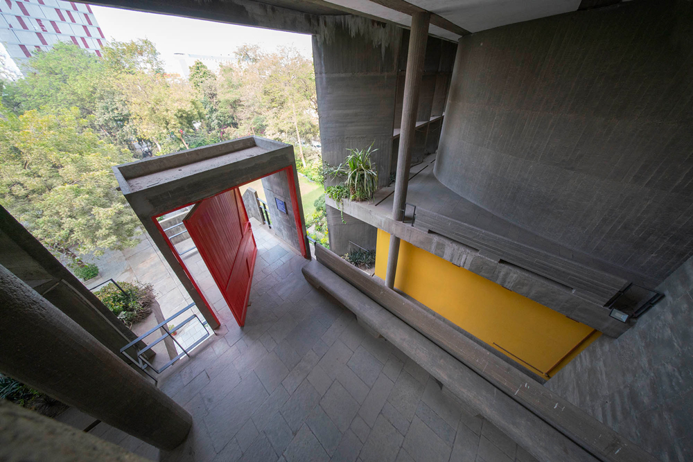 view from first floor down towards open red door