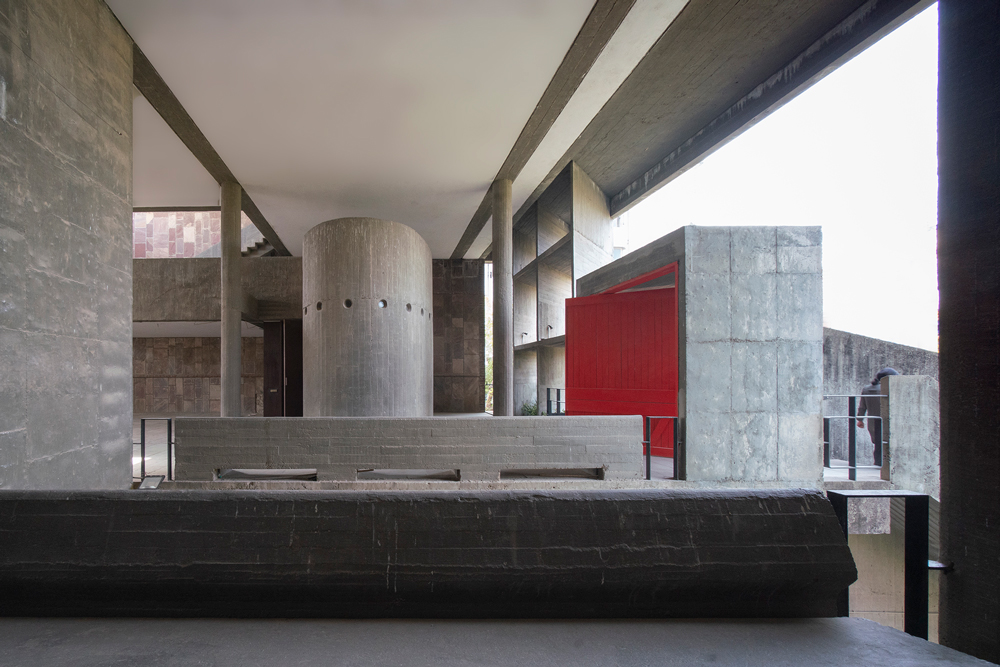 View towards red door and concrete pillar