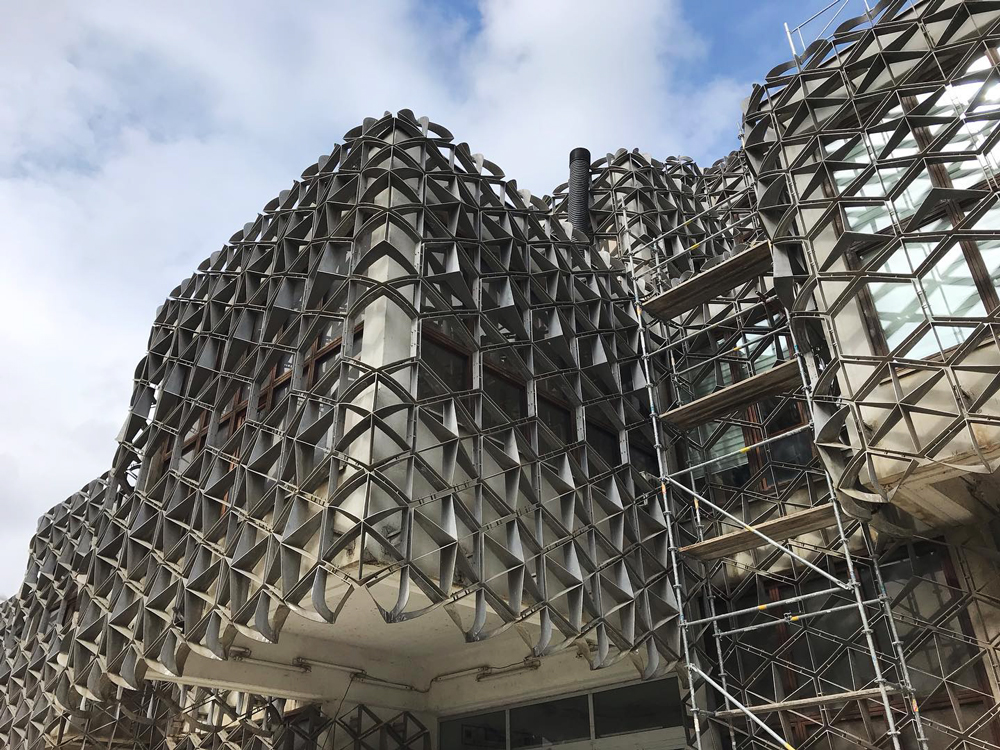 detailed cube covered in metal covering facade of national library of kosovo