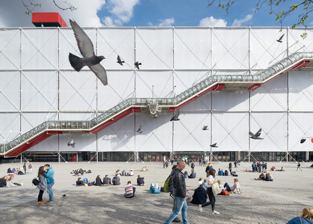 view of side and stairs of pompidou centre paris with birds and couple kissing