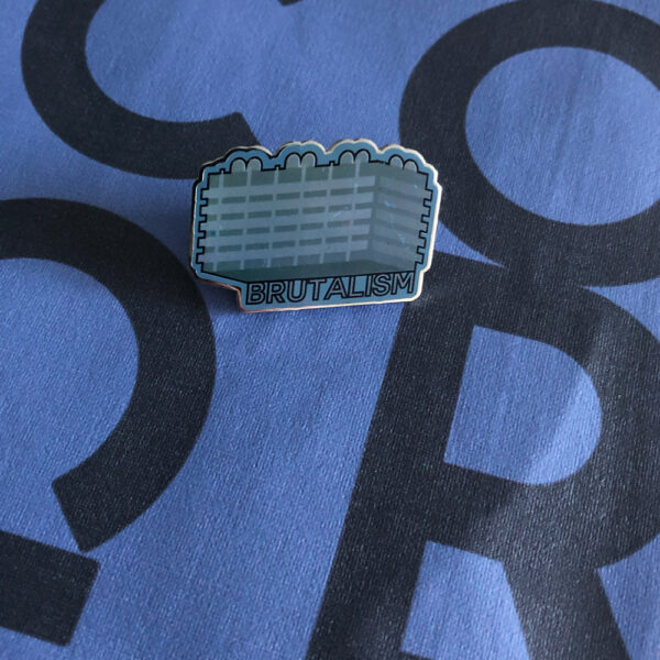 grey metal graphic badge with word brutalism
