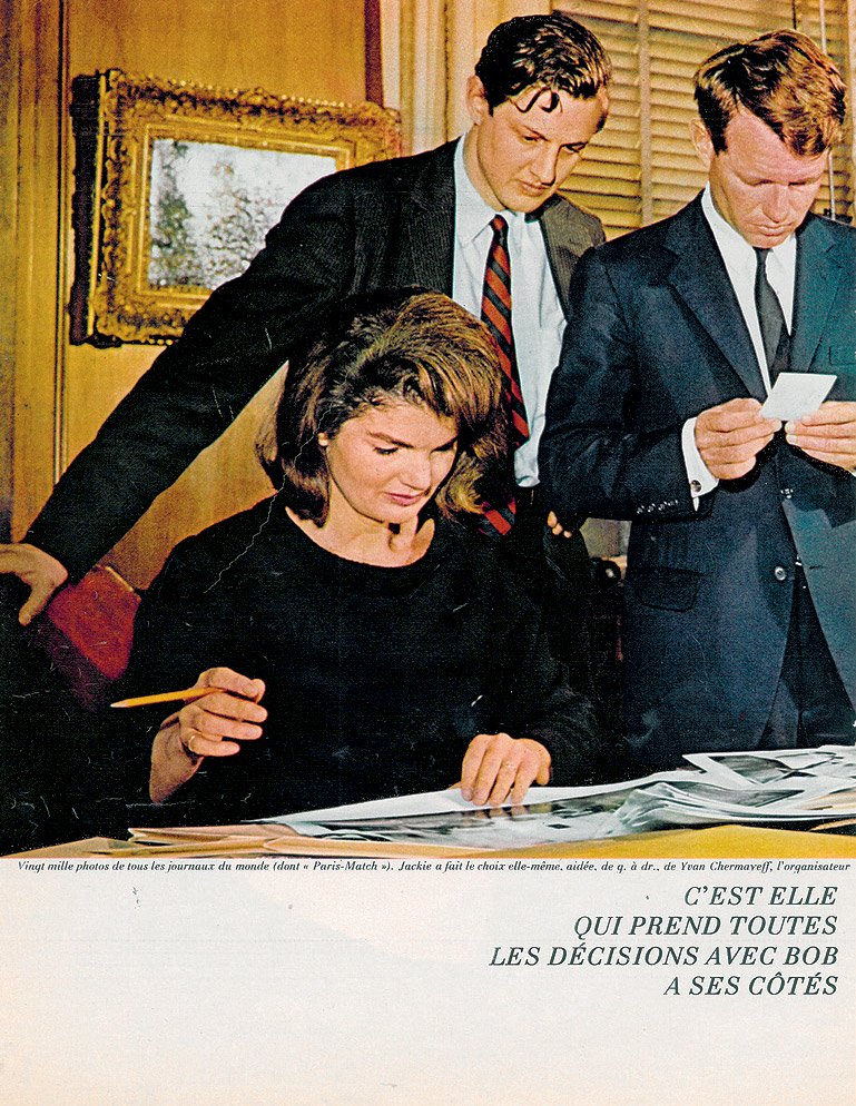 jackie kennedy with Robert and Ivan looking at images