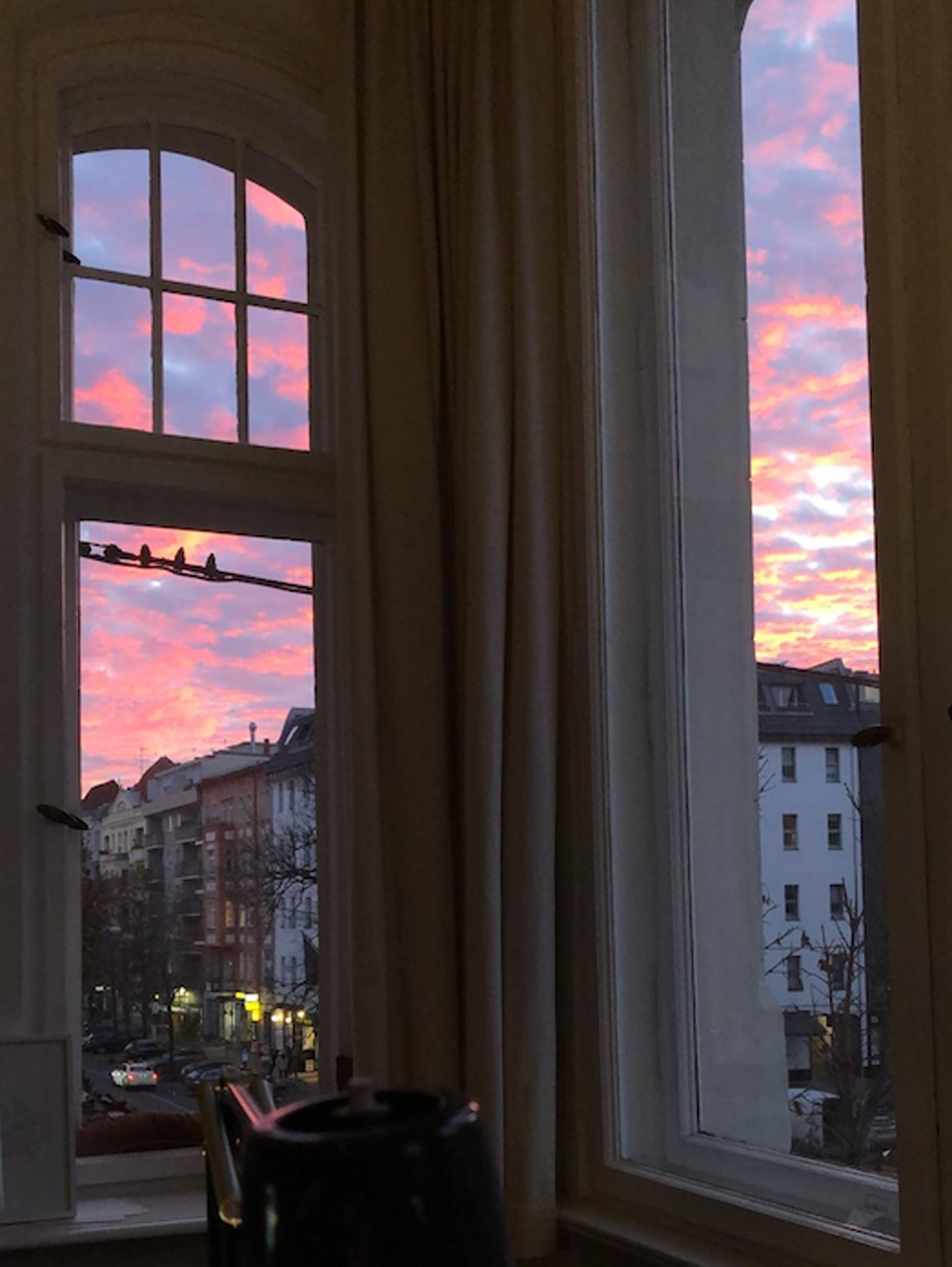 view of dawn from residential appartment with pink sky