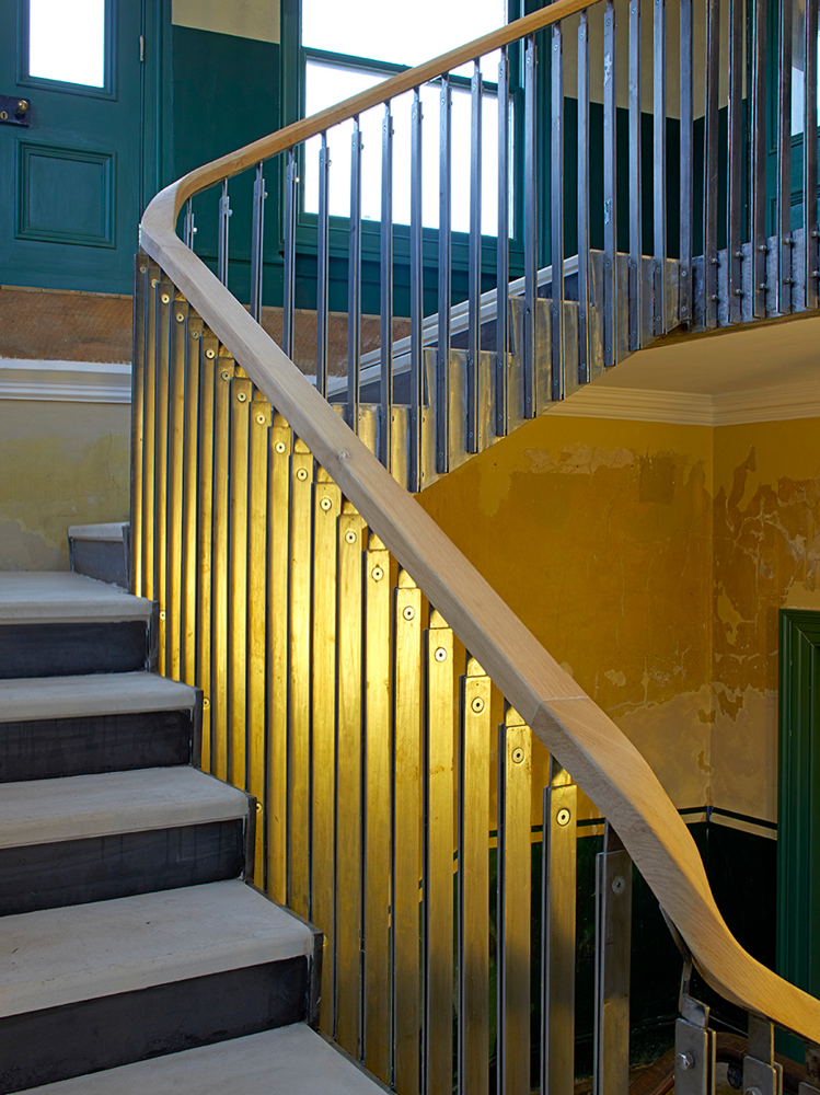 stair case midway up with view of window peckham rye staton