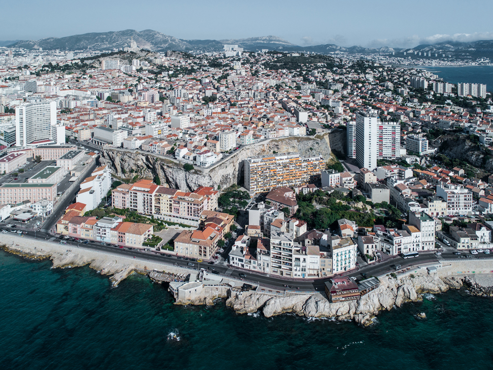 city and coastal view of marseille by drone