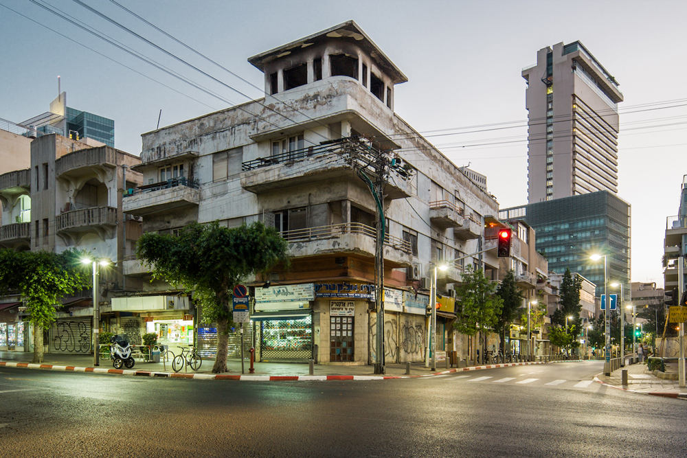 distressed modernist building with store on ground floor tel aviv Israel 