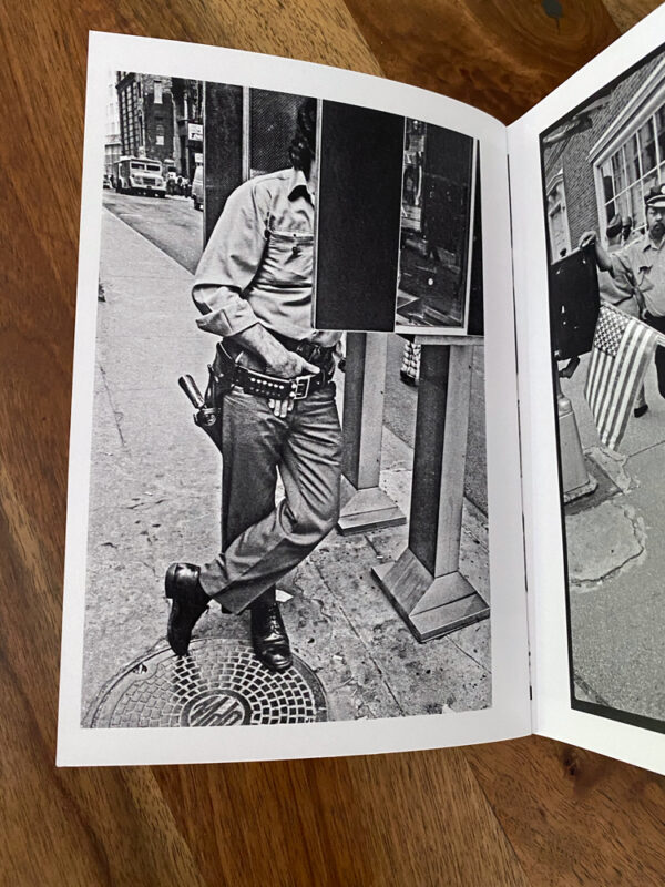 armed man at public telephone booth new york city