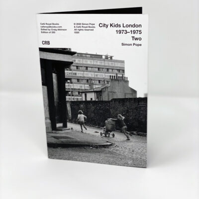 front cover with image of children in the streets of east end