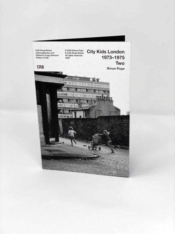 front cover with image of children in the streets of east end