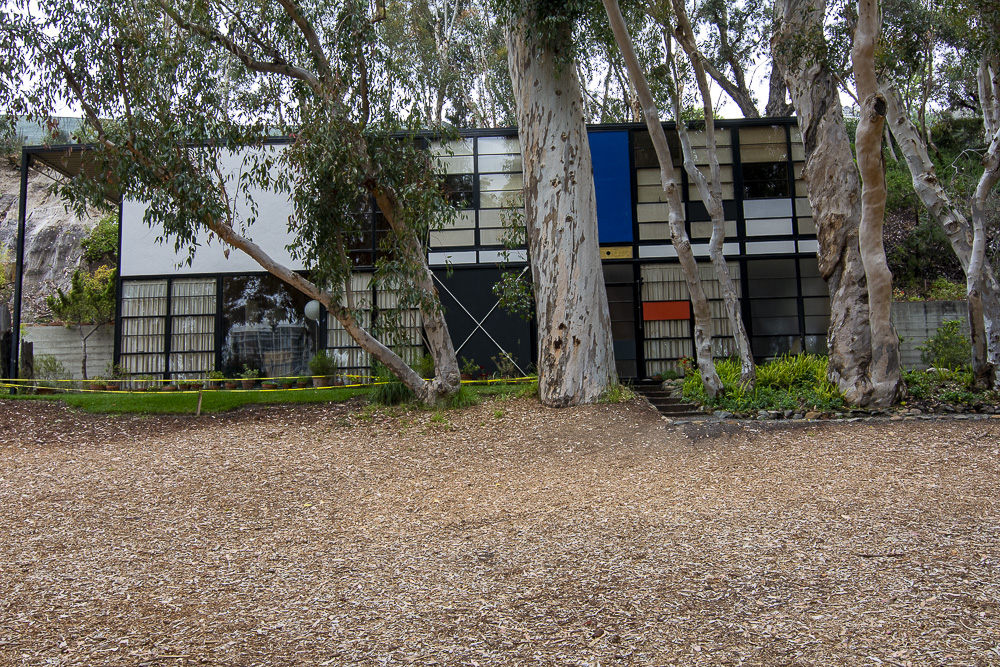 Obscured by trees that have grown up since it was built, the front of the Eames House
