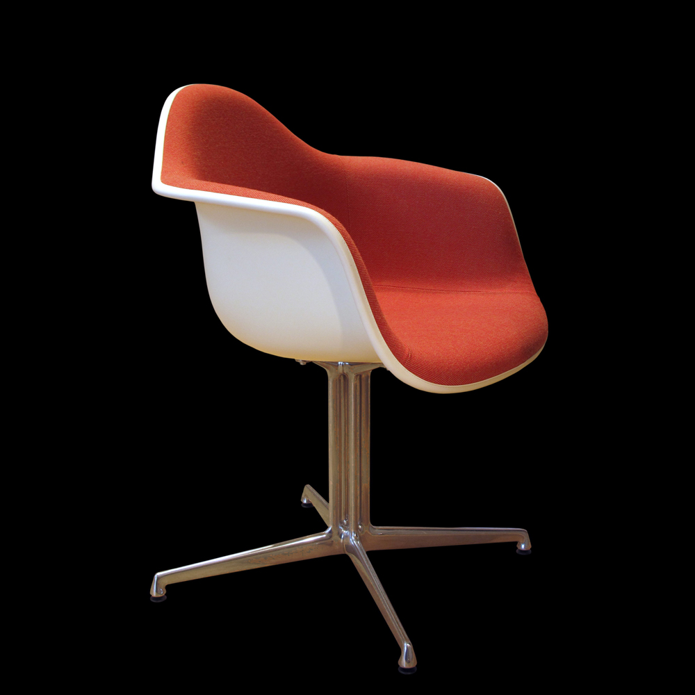 white chair with orange fabric trim 