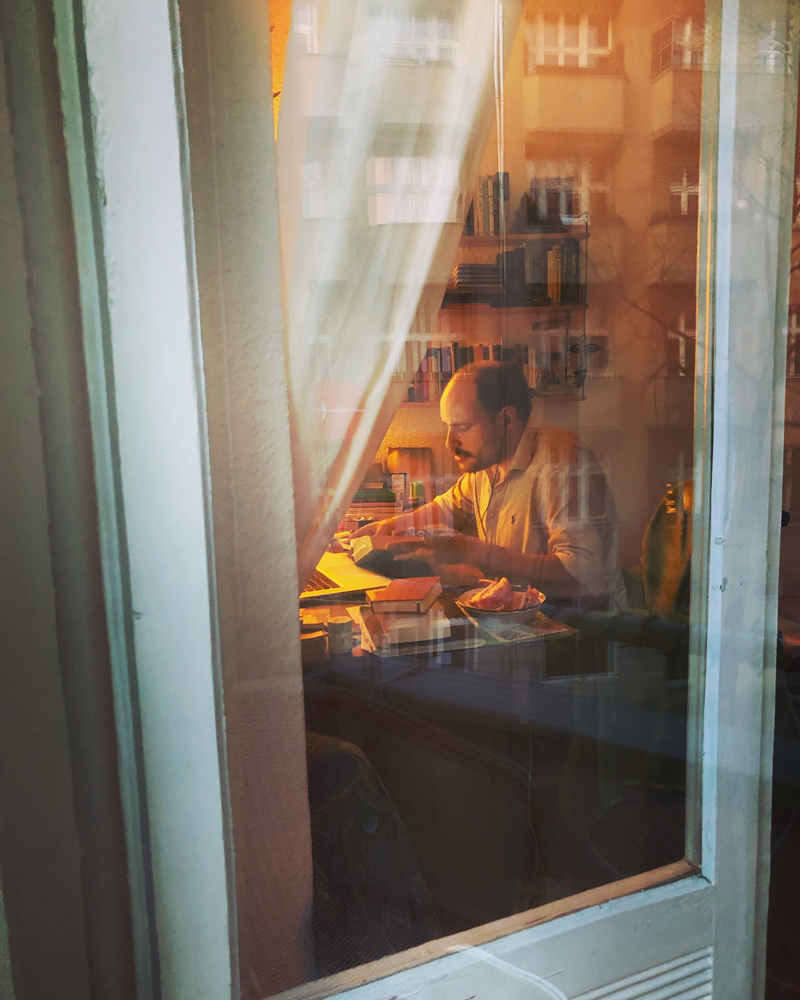 view of a man at a desk in berlin under lockdown