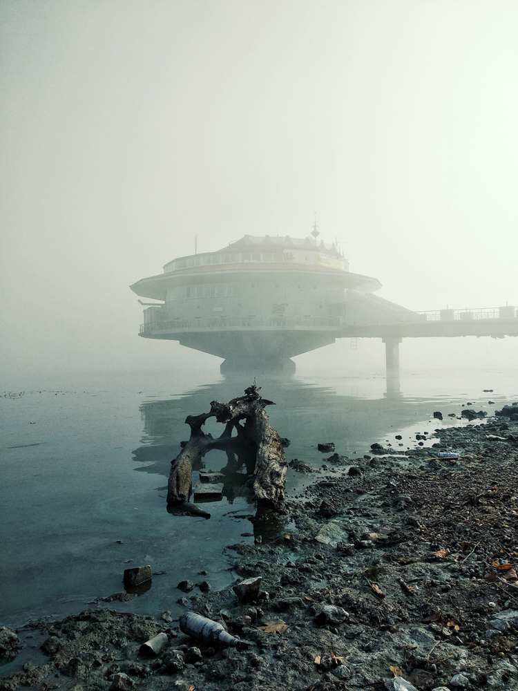 cafe in mist overlooking the river