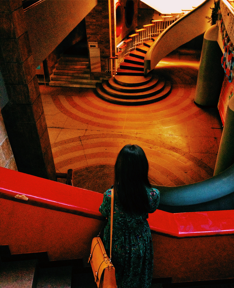 red and wood interior from top of staircase