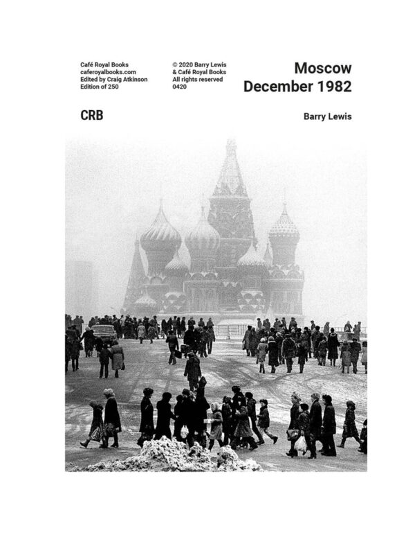 people walking in red square with snow underfoot and st basil in teh background