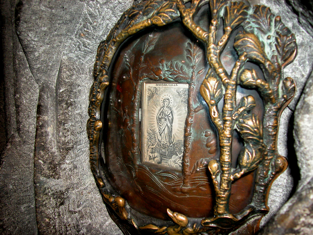 image of Mary fused into the wall of the church