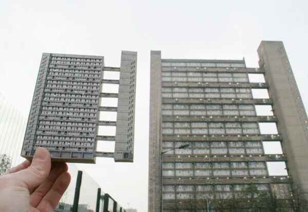 graphic held up against balfron tower poplar