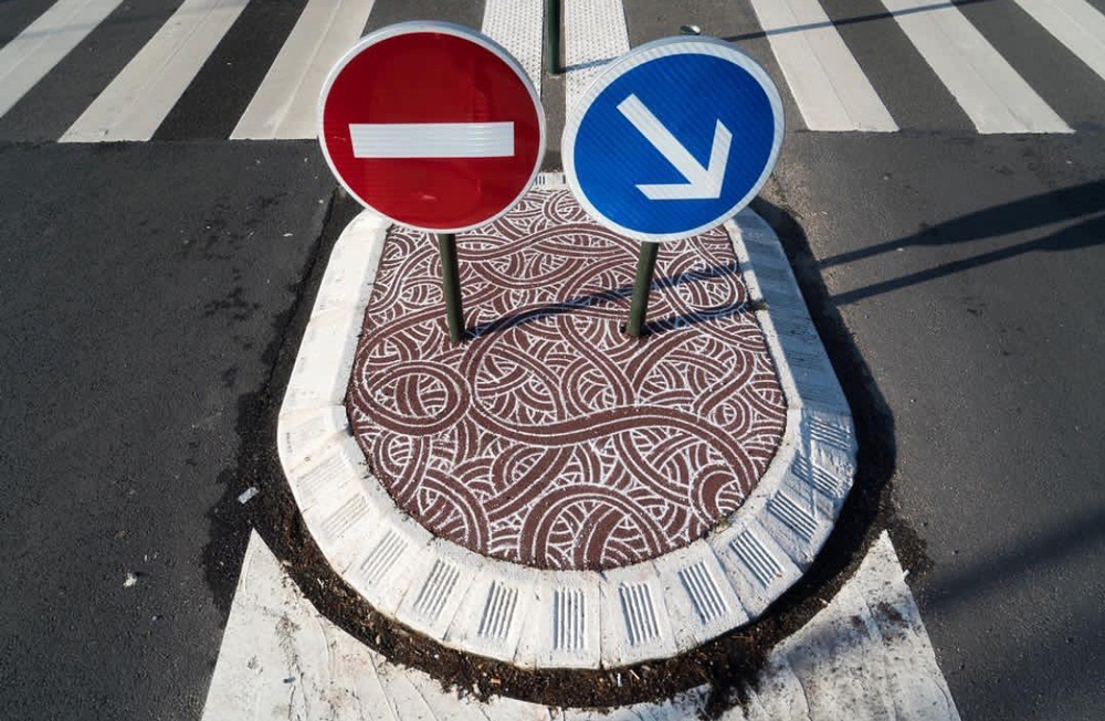 no entry and this side signs on jordan saget decorated traffic island
